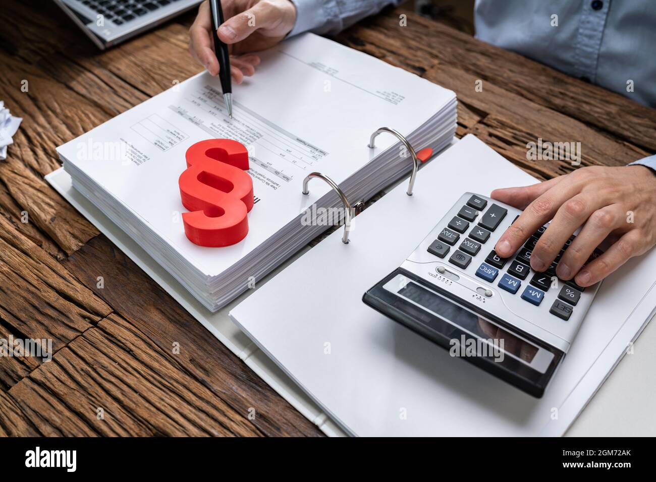 Red Paragraph And Calculator At Judicial Attorney Desk Stock Photo
