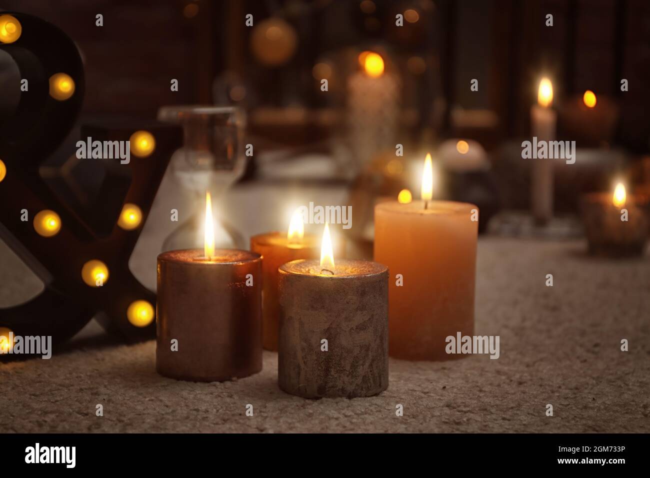 Burning candles on floor indoors Stock Photo Alamy