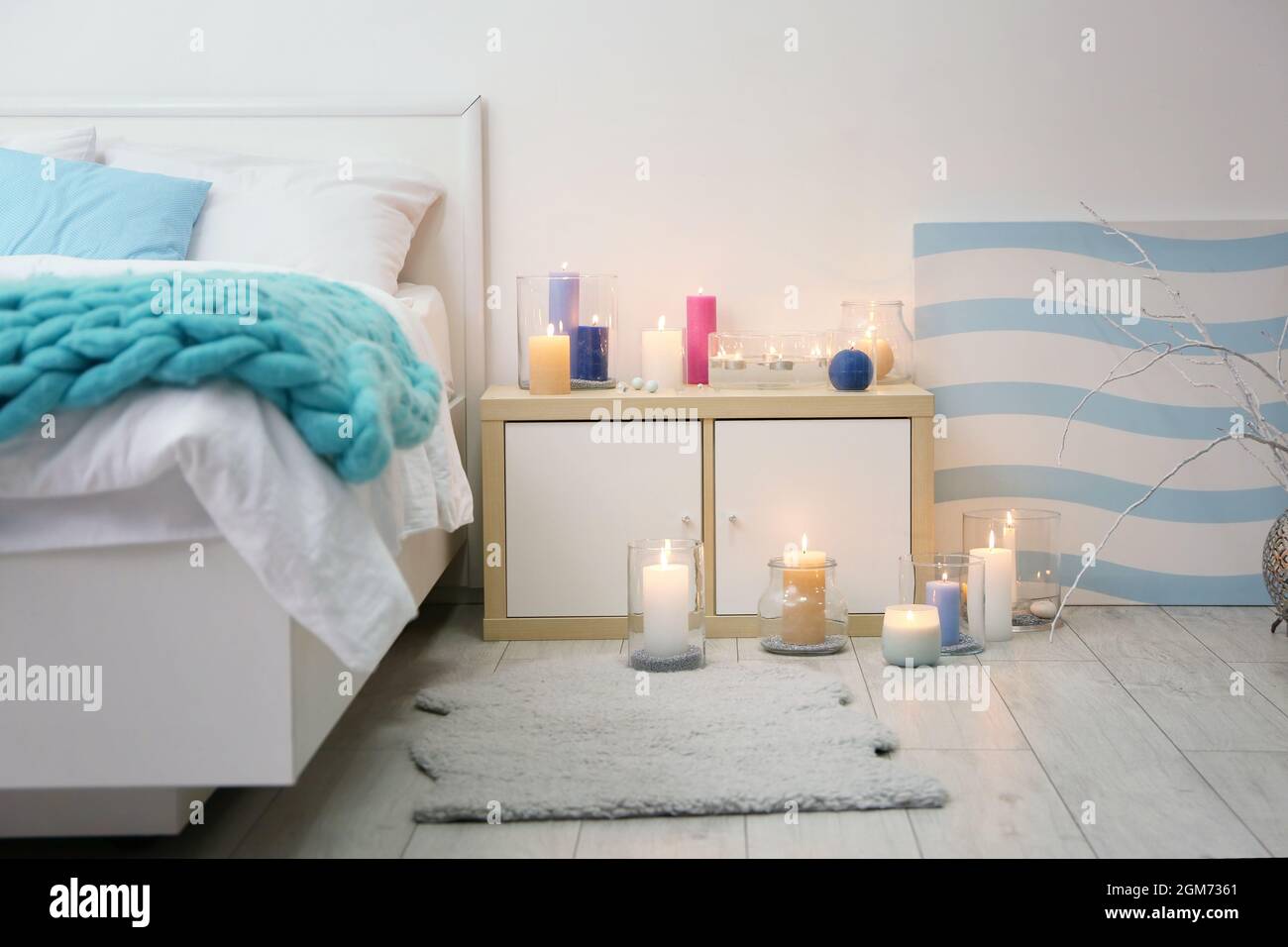 Cozy bedroom decorated with burning candles Stock Photo Alamy