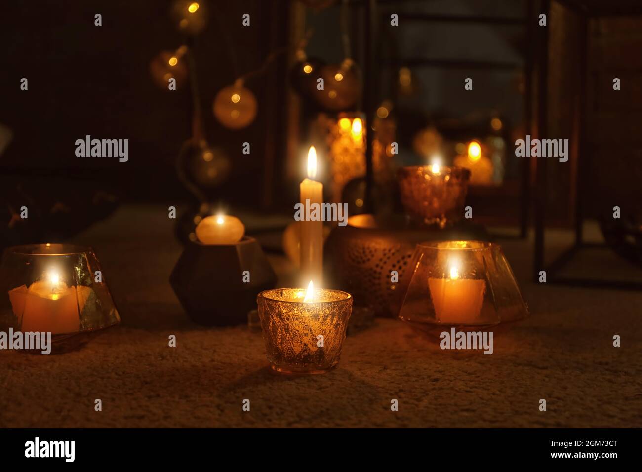 Burning candles on floor indoors Stock Photo Alamy