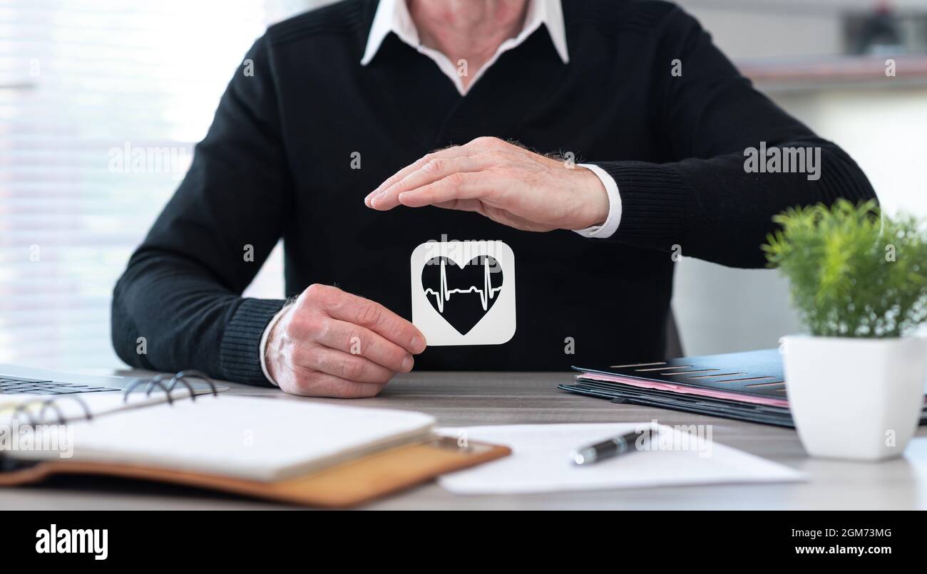 Heartbeat symbol protected by hand - Concept of health insurance Stock ...