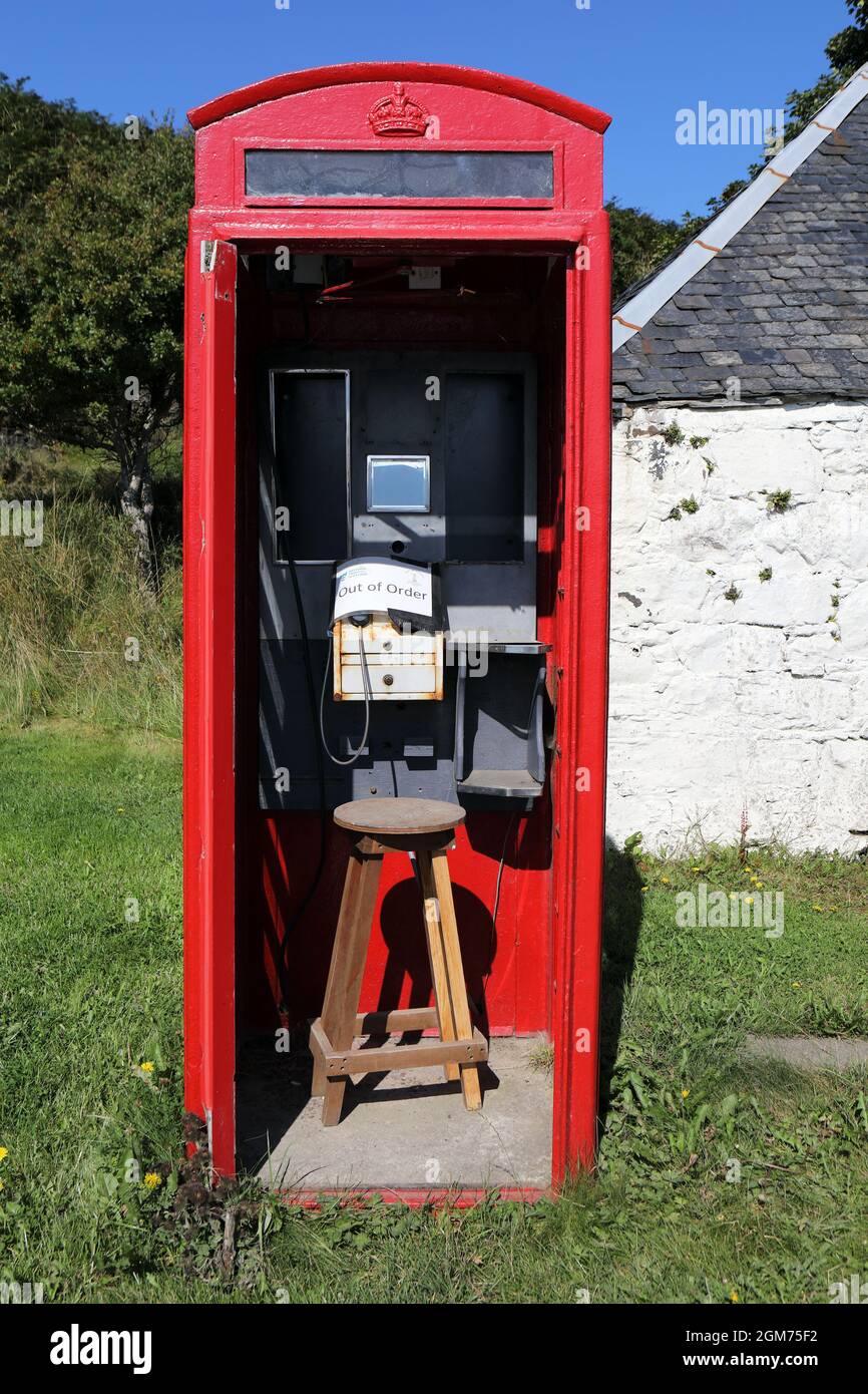 Out of order sign in a red telephone box on the Isle of Canna in the Inner Hebrides of Scotland Stock Photo