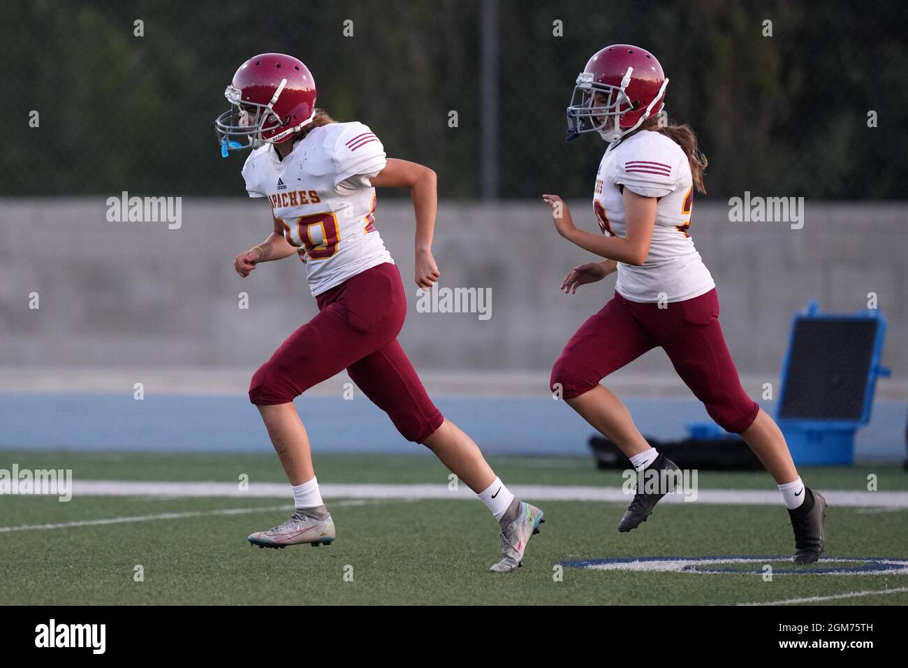 Arcadia Apaches punter Kayla Ibrahim (20) and kicker Victoria Kenworthy (28) during a high