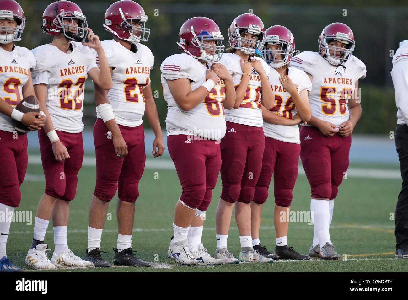 Arcadia Apaches wide receivers Andrew Garcia (22) and Tai Huda (24), punter Kayla Ibrahim (28), kicker Victoria Kenworthy (20) and guard Luke Guerra ( Stock Photo