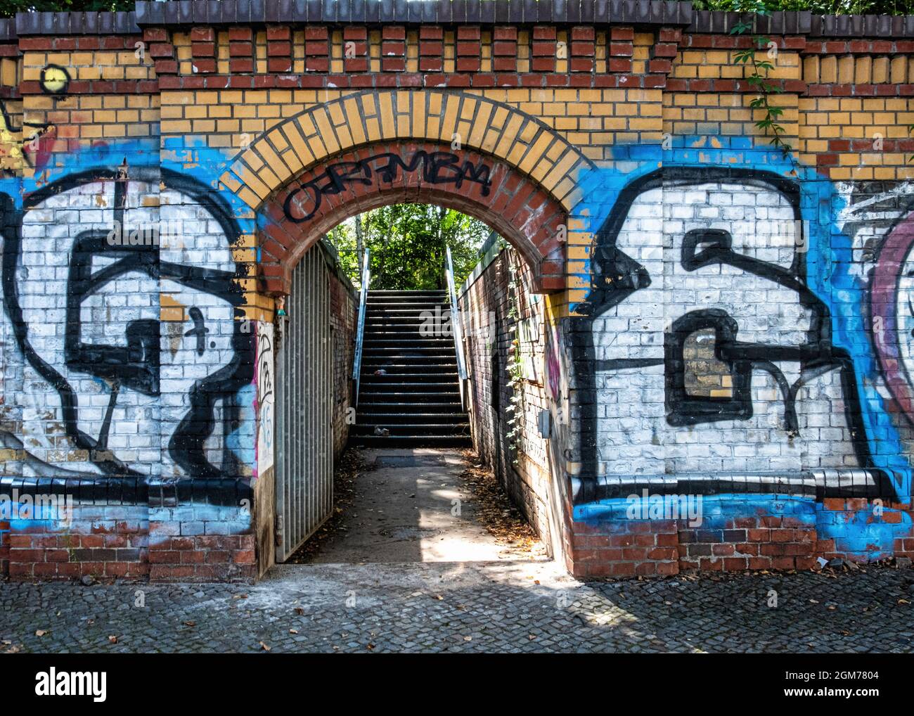 Brick wall of elevated Szczecin station used as part of Berlin Wall ...