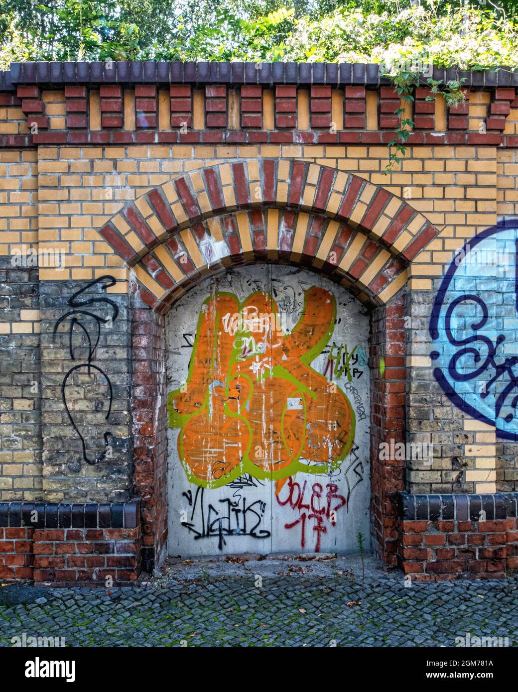 Brick wall of elevated Szczecin station used as part of Berlin Wall ...