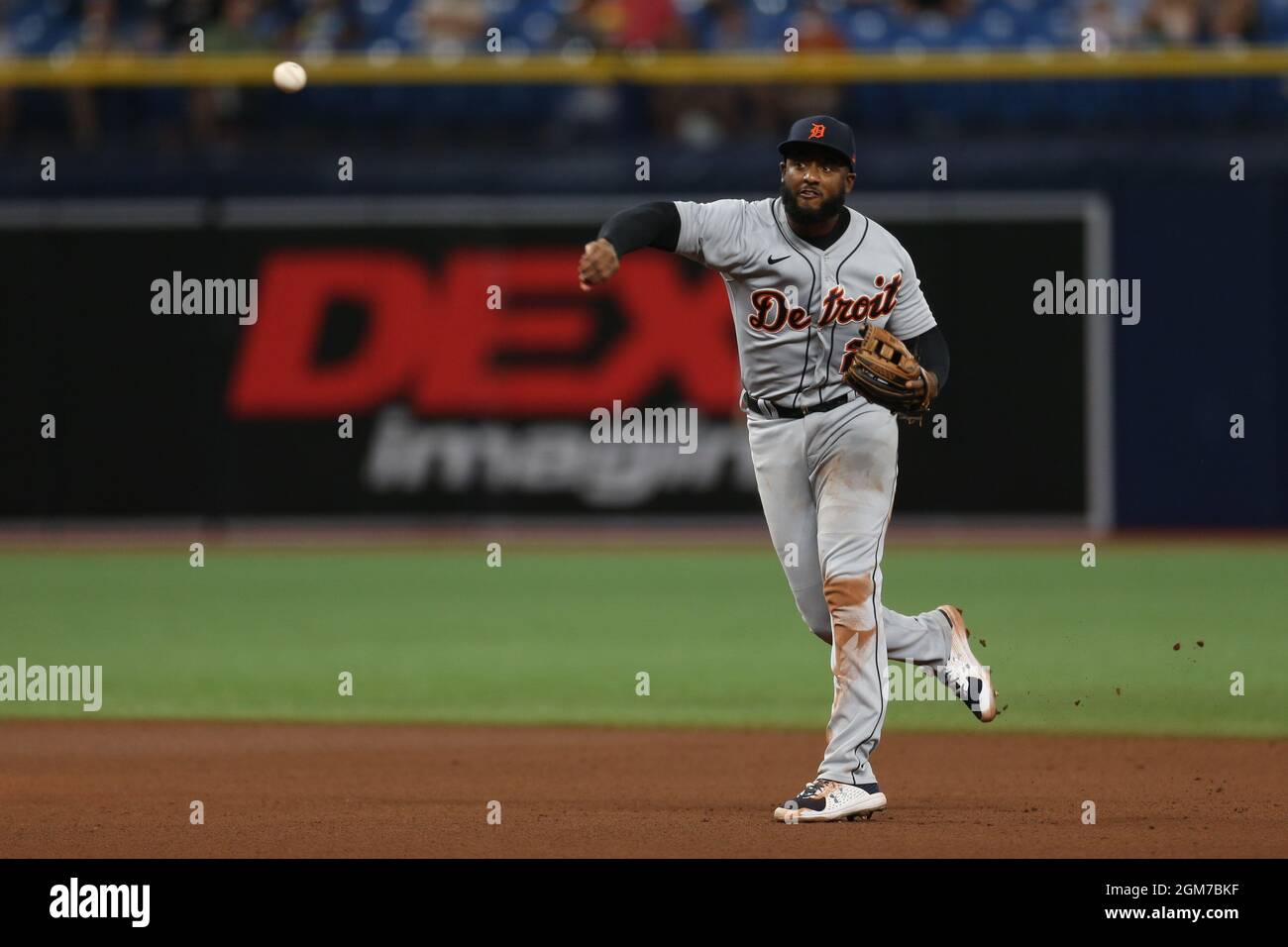 St. Petersburg, FL. USA;  Detroit Tigers third baseman Niko Goodrum (28) jumps up and grabs a ball that almost went over his head and throws to first Stock Photo