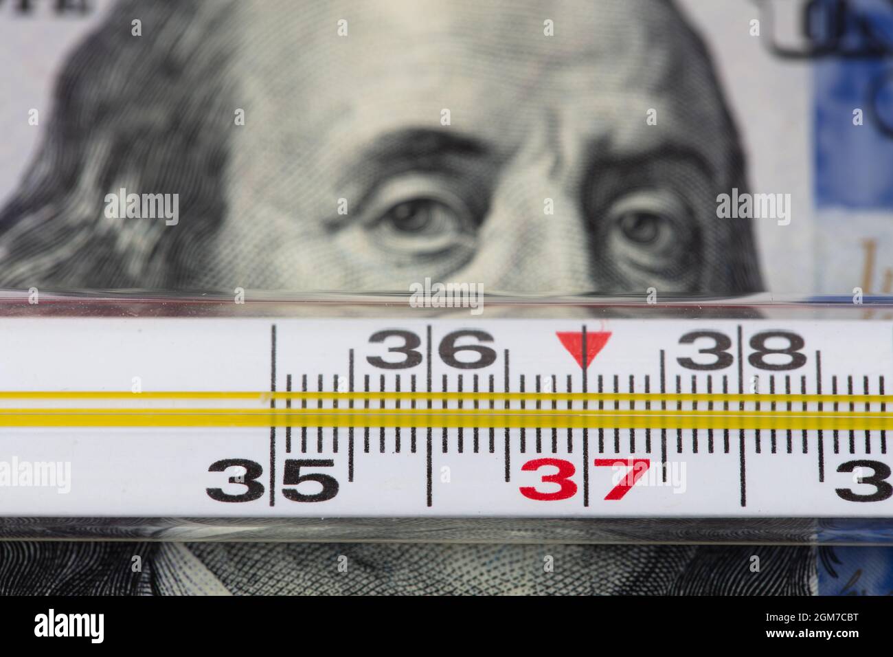 100 dollar bill and thermometer Stock Photo Alamy