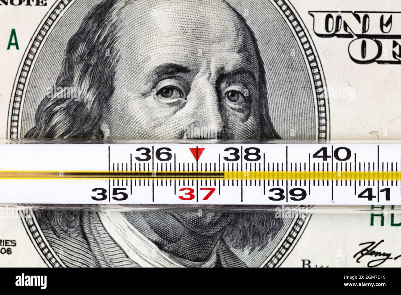 100 dollar bill and thermometer Stock Photo Alamy