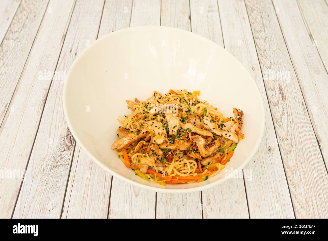 Chicken yakisoba noodles sautéed with vegetables and poppy seeds