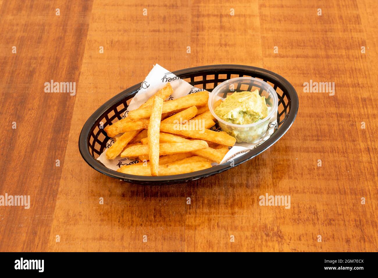 Fried yucca cut with chips with guacamole for dipping Stock Photo