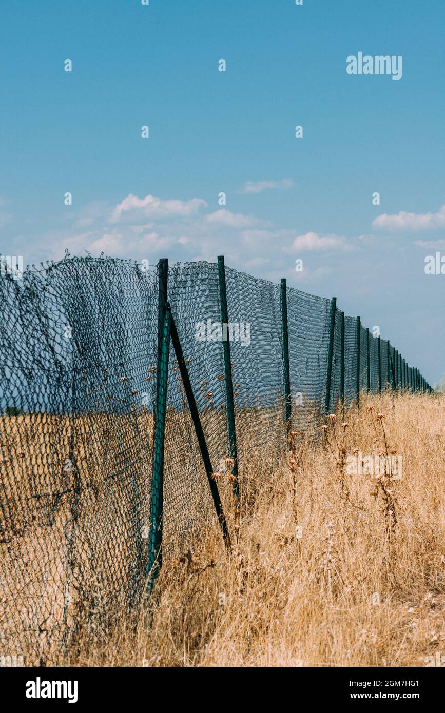Vertical shot fence barrier hi-res stock photography and images - Alamy