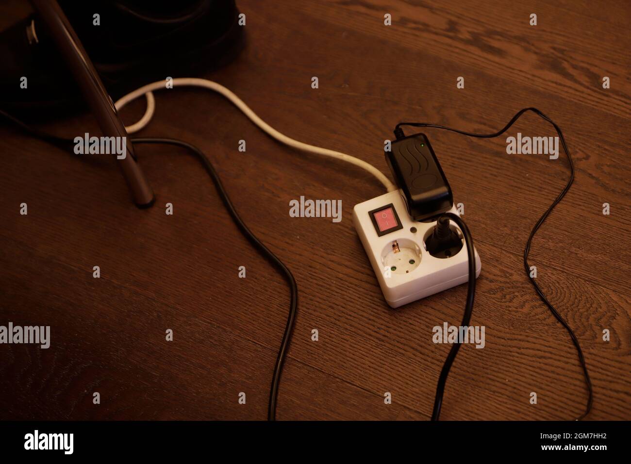 extension cord with plug and mobile phone charger Stock Photo Alamy