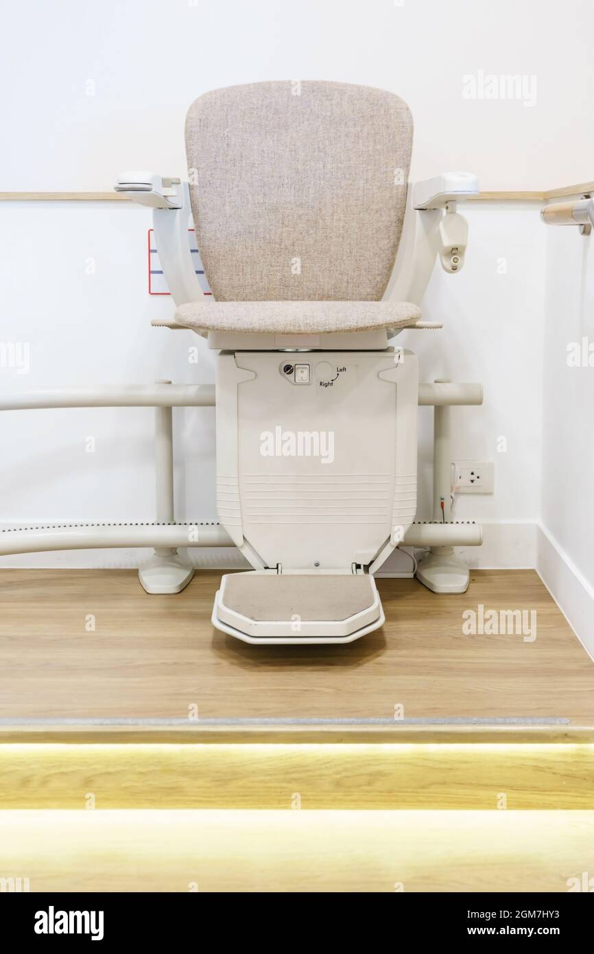 Automatic stair lift on staircase for elderly people and disabled
