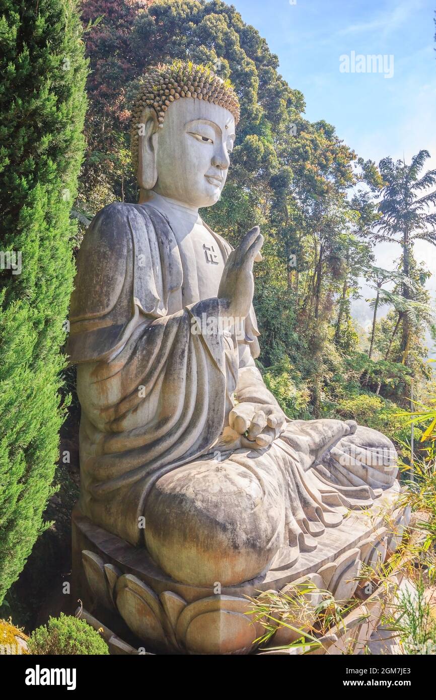 Large stone Buddha statue at Chin Swee Caves Temple in Genting