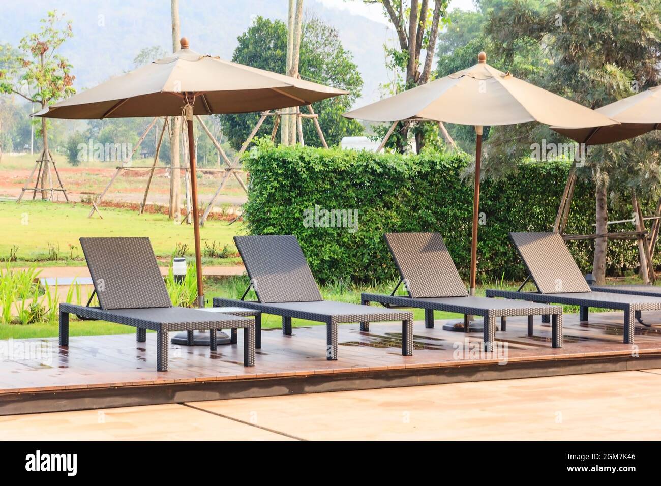 comfortable chair at the swimming pool, modern chair, sunlight on the ...