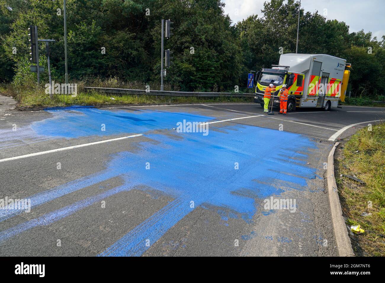 Highways England workers on the exit slip road of the M25 motorway near
