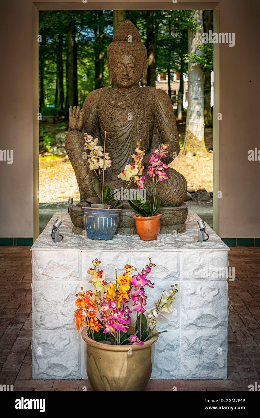 JÖNSTORP, SWEDEN - JULY 18, 2021: A statue of a sitting buddha at the yangtorp sanctuary in Skåne. Stock Photo