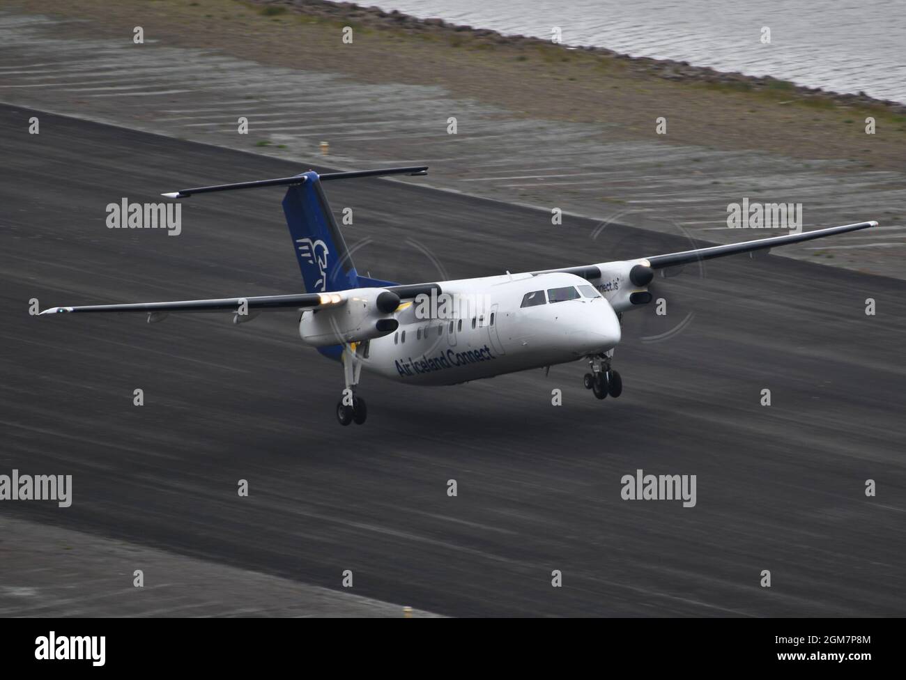 Air Iceland Connect Dash8-200 taking off from Isafjördur airport Stock Photo