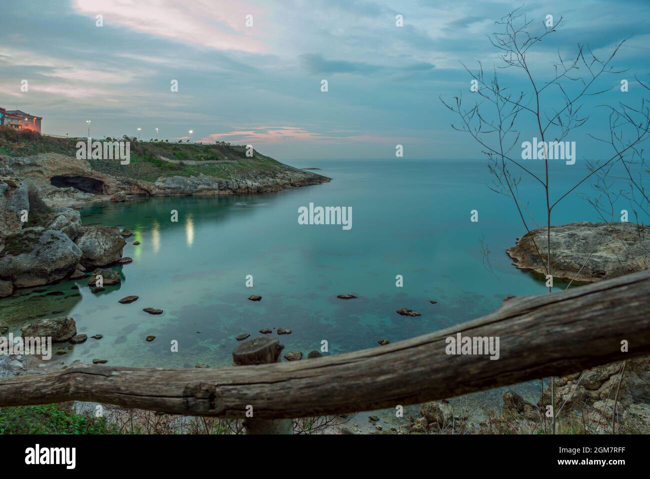 Wooden railing at a viewpoint on the Turkish Black Sea coast in the town of Sile. Long exposure image at sunrise Stock Photo