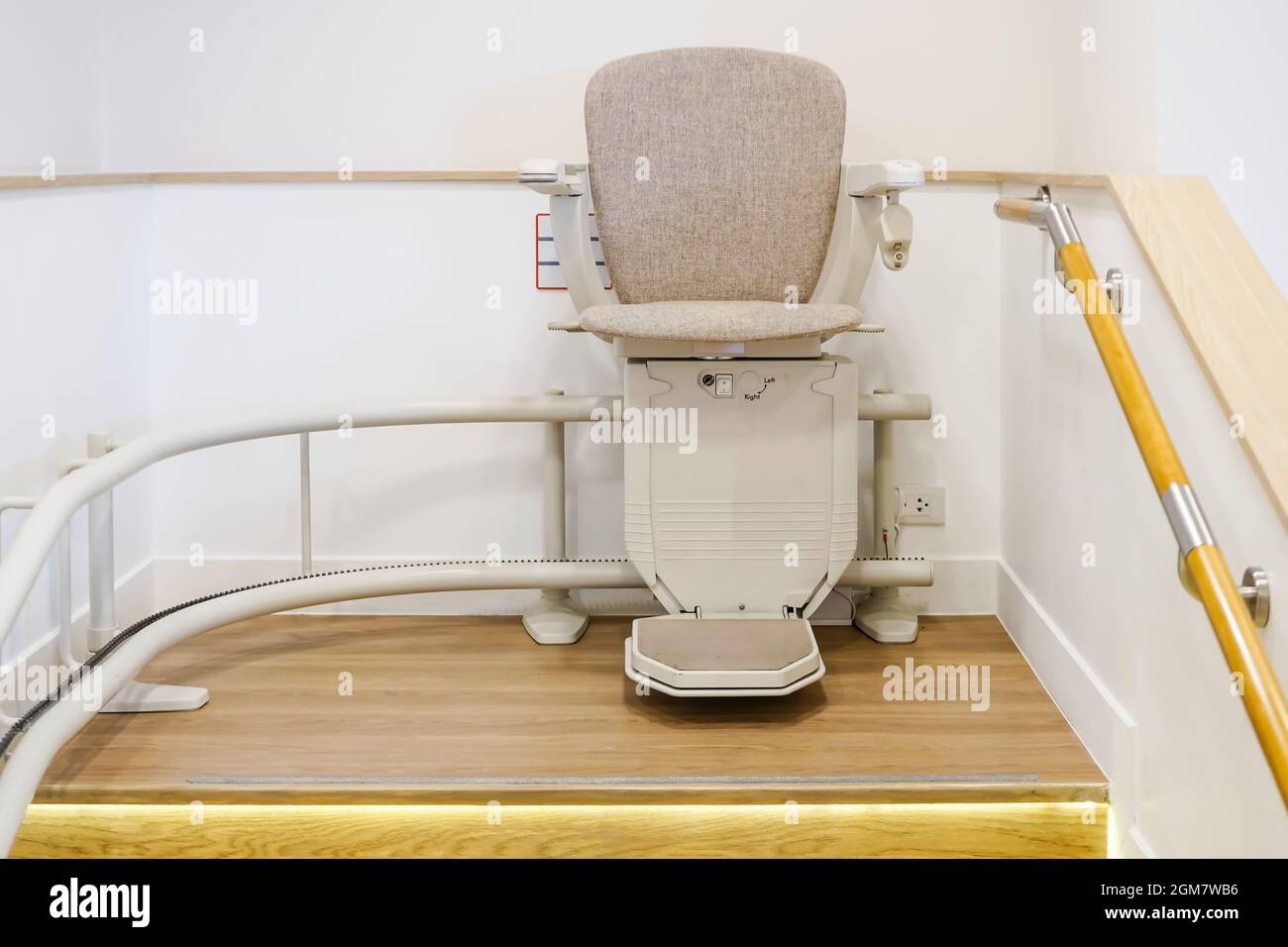 Automatic stair lift on staircase for elderly people and disabled