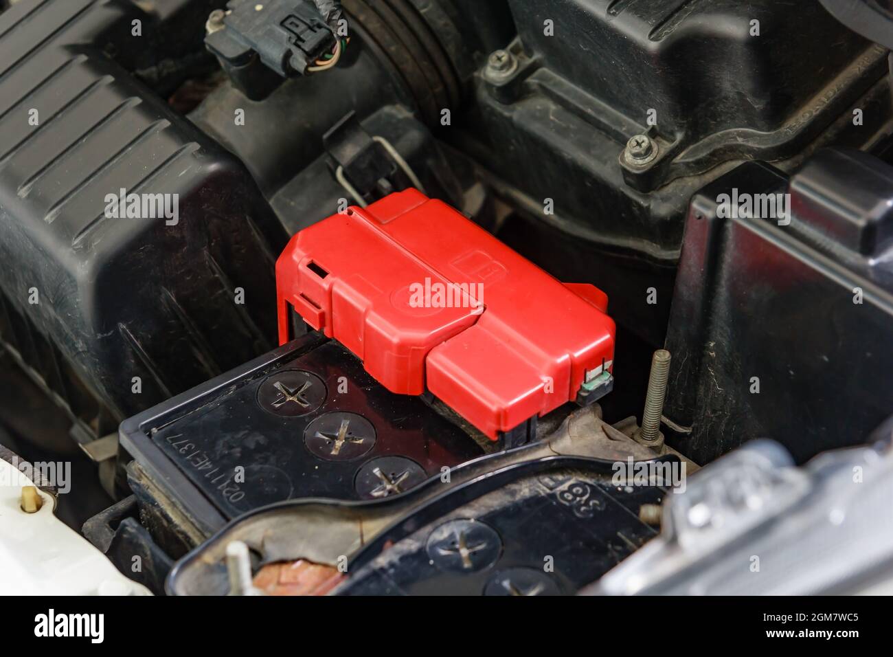 Car battery terminal with red positive polarity Stock Photo - Alamy