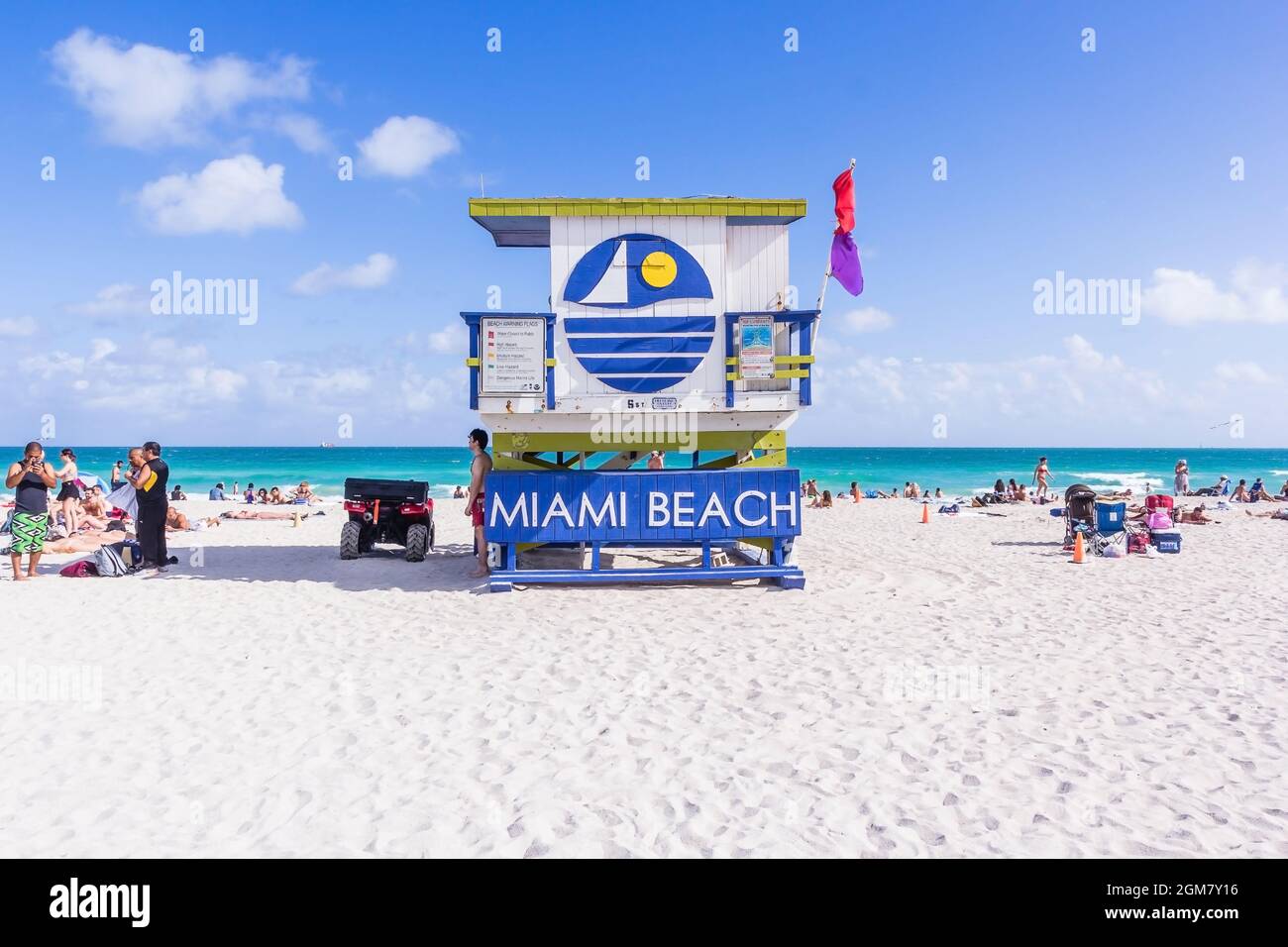 MIAMI, USA - JANUARY 01, 2017: Summer scene with a typical colorful lifeguard house in Miami Beach, Florida with blue sky and ocean in the background Stock Photo