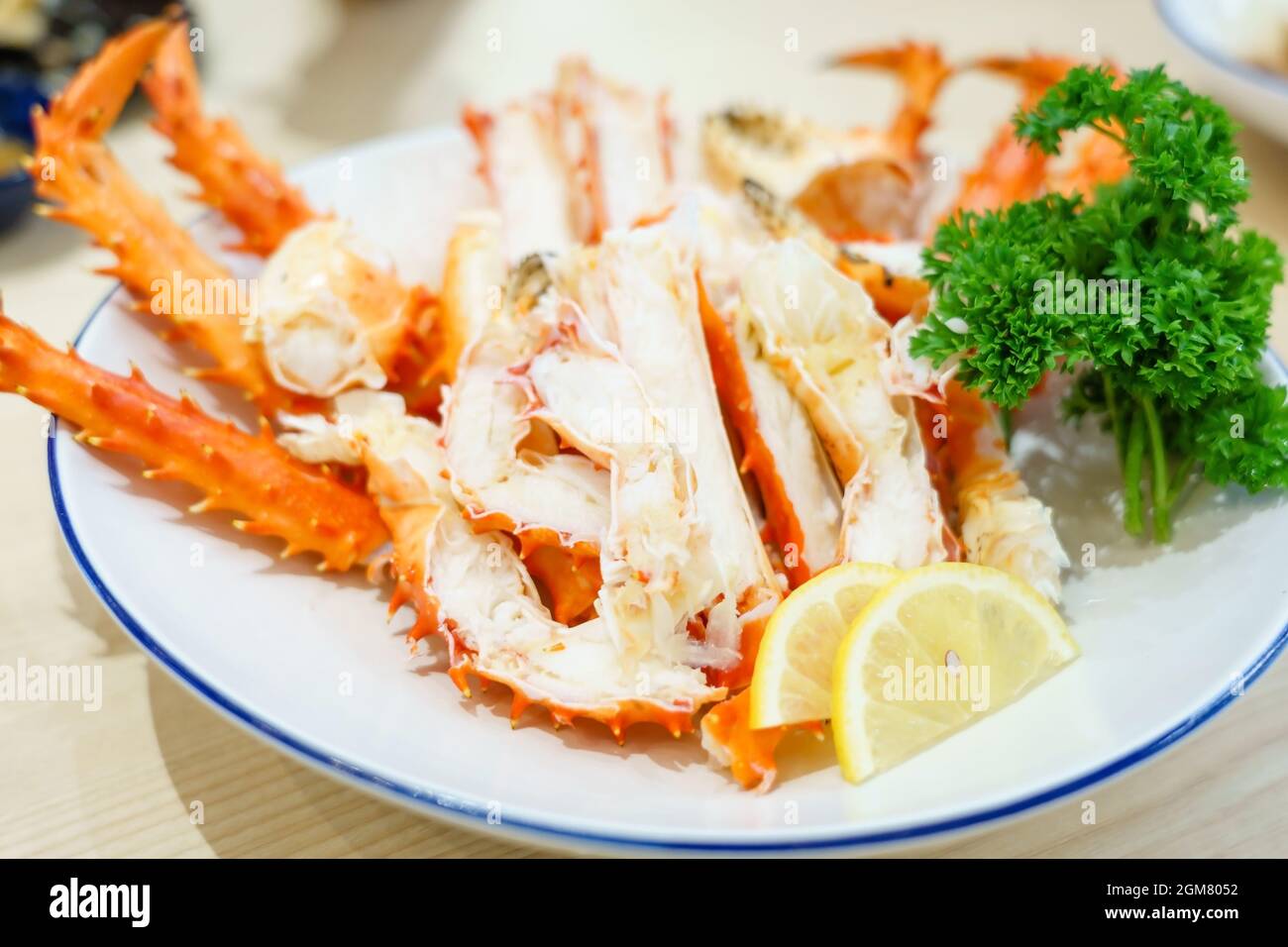 Red king crab legs with fresh lemon slices, Hanasaki crab sashimi