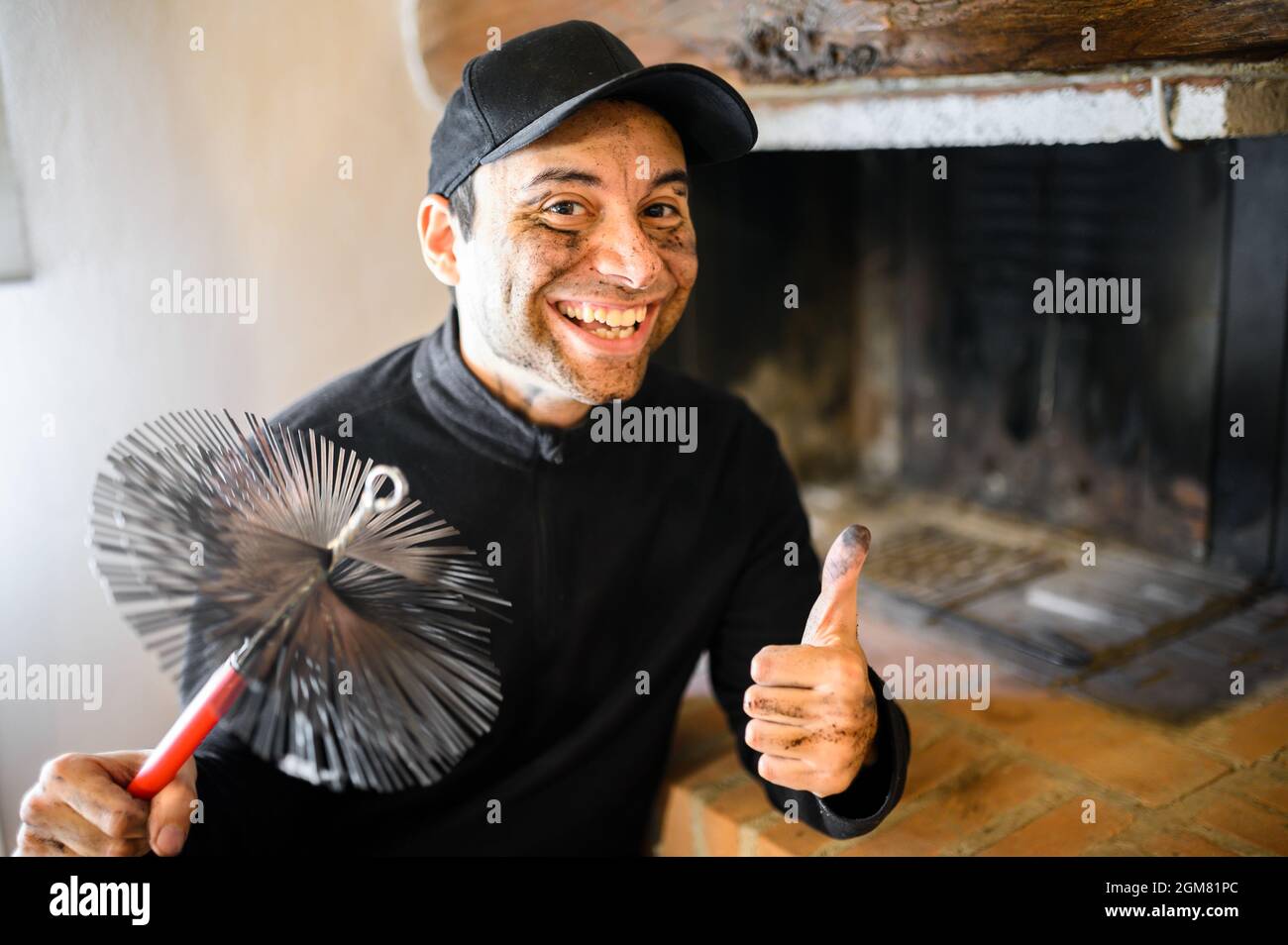 Young chimney sweep portrait in a house giving thumbs up Stock Photo Alamy