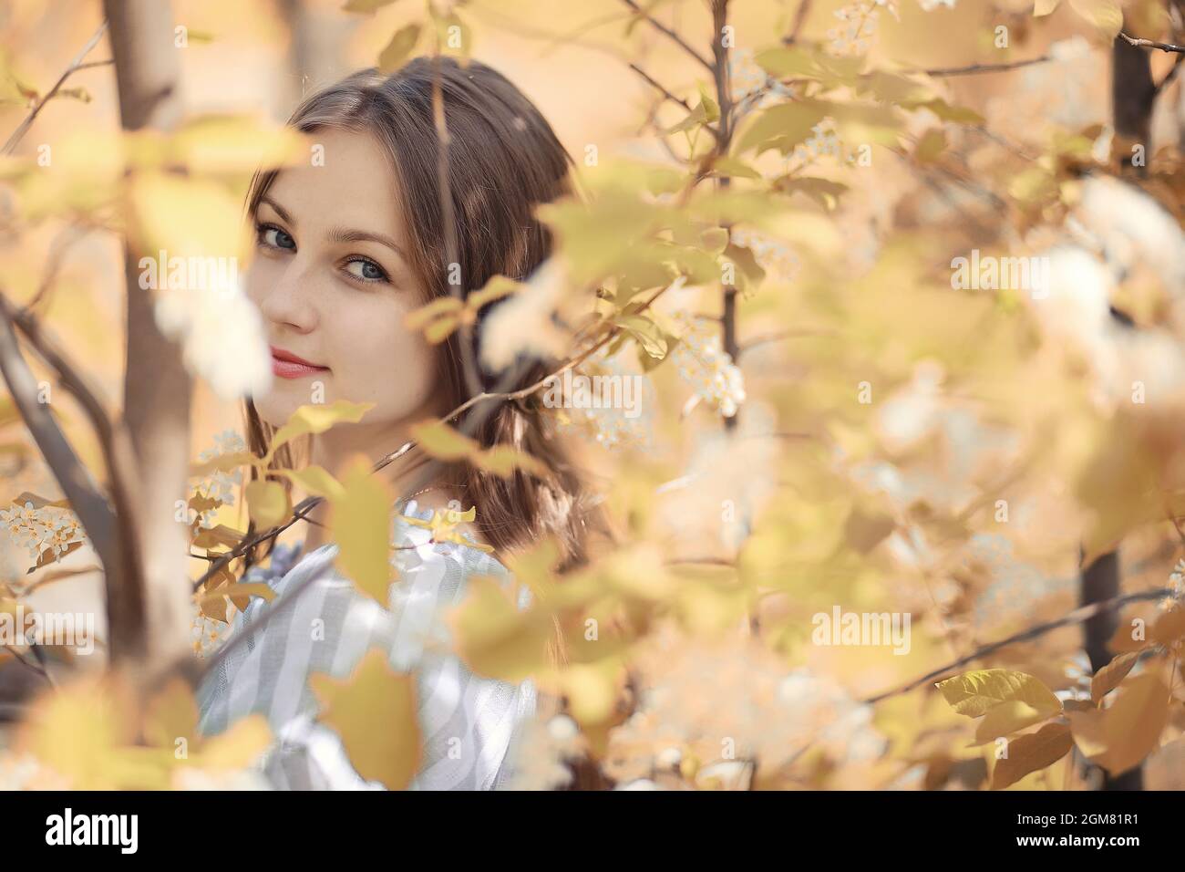 Young girl on a walk in the autumn park Stock Photo - Alamy