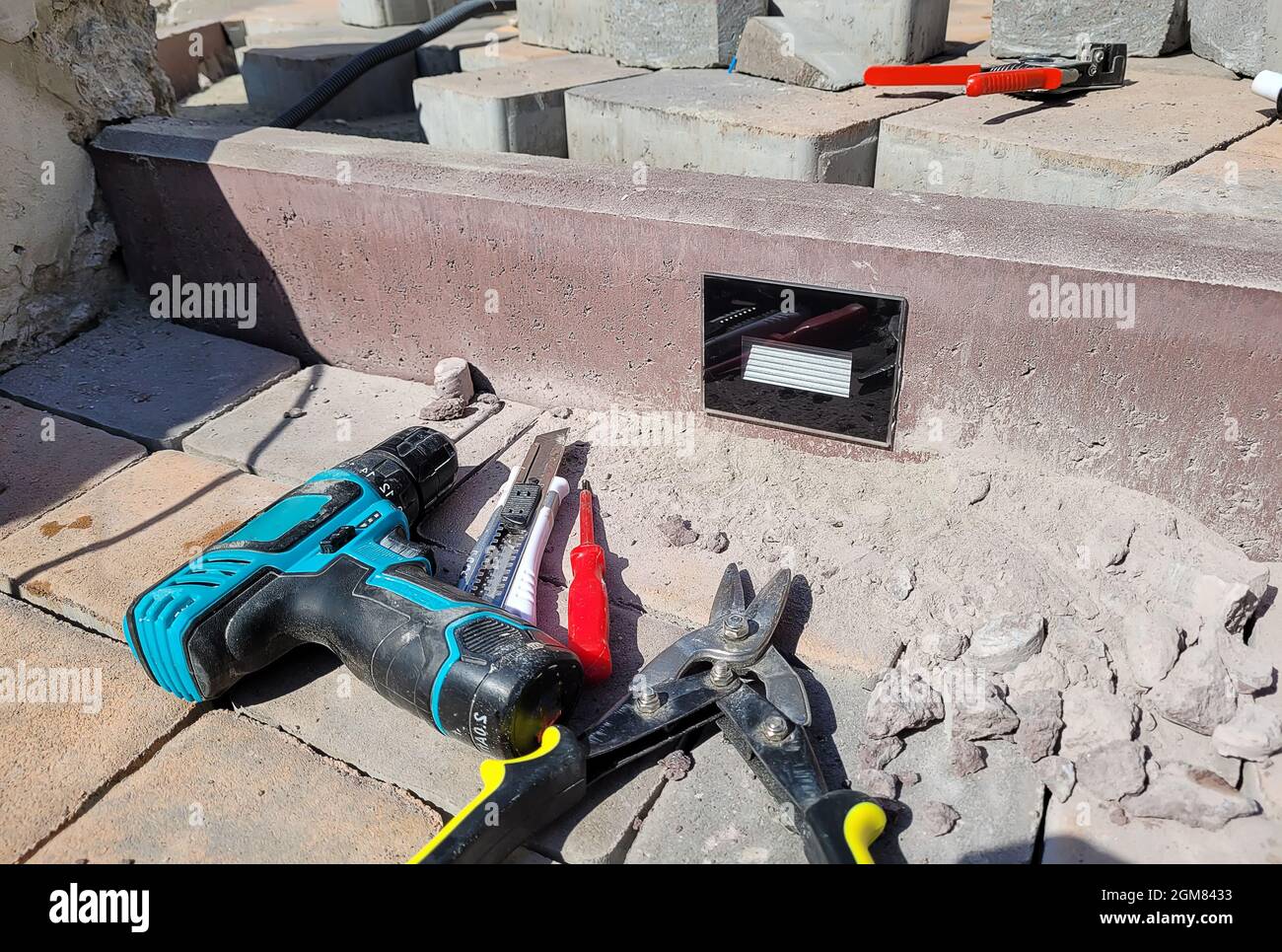 installation of the lamp in a concrete curb. Selective focus Stock Photo
