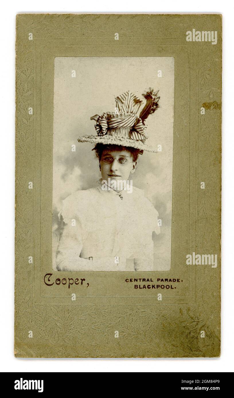 Original embossed CDV (Carte de Visite or visiting card) of young lady, girl, wearing elaborate straw hat, glasses, white summer dress, Studio of Cooper, Central Parade, Blackpool, Lancashire,  U.K. circa 1897 Stock Photo