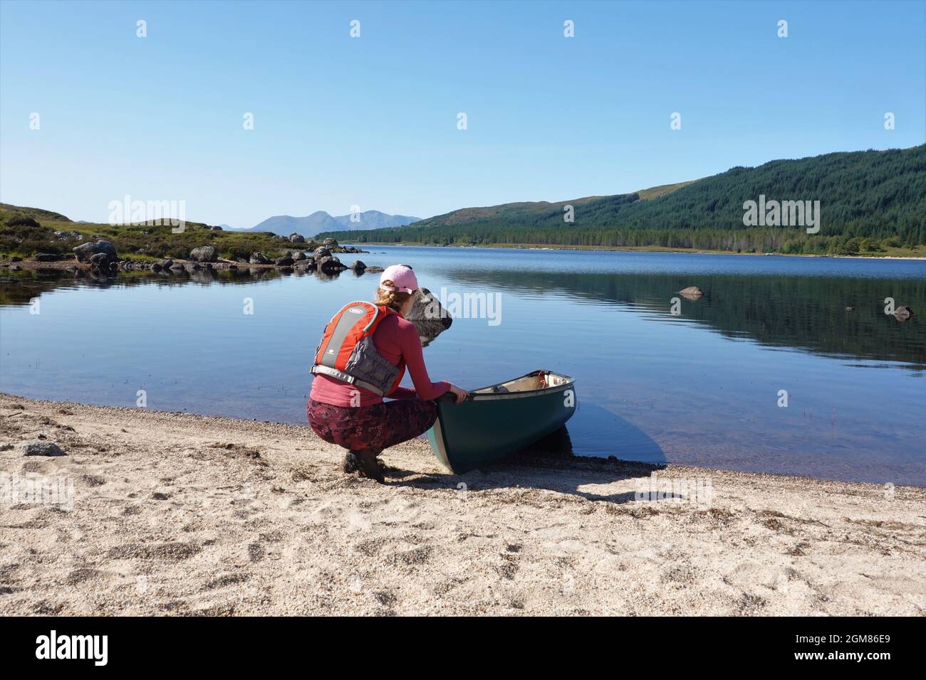 Canadian canoe on beach at Loch Laidon, Scottish Highlands, Scotland