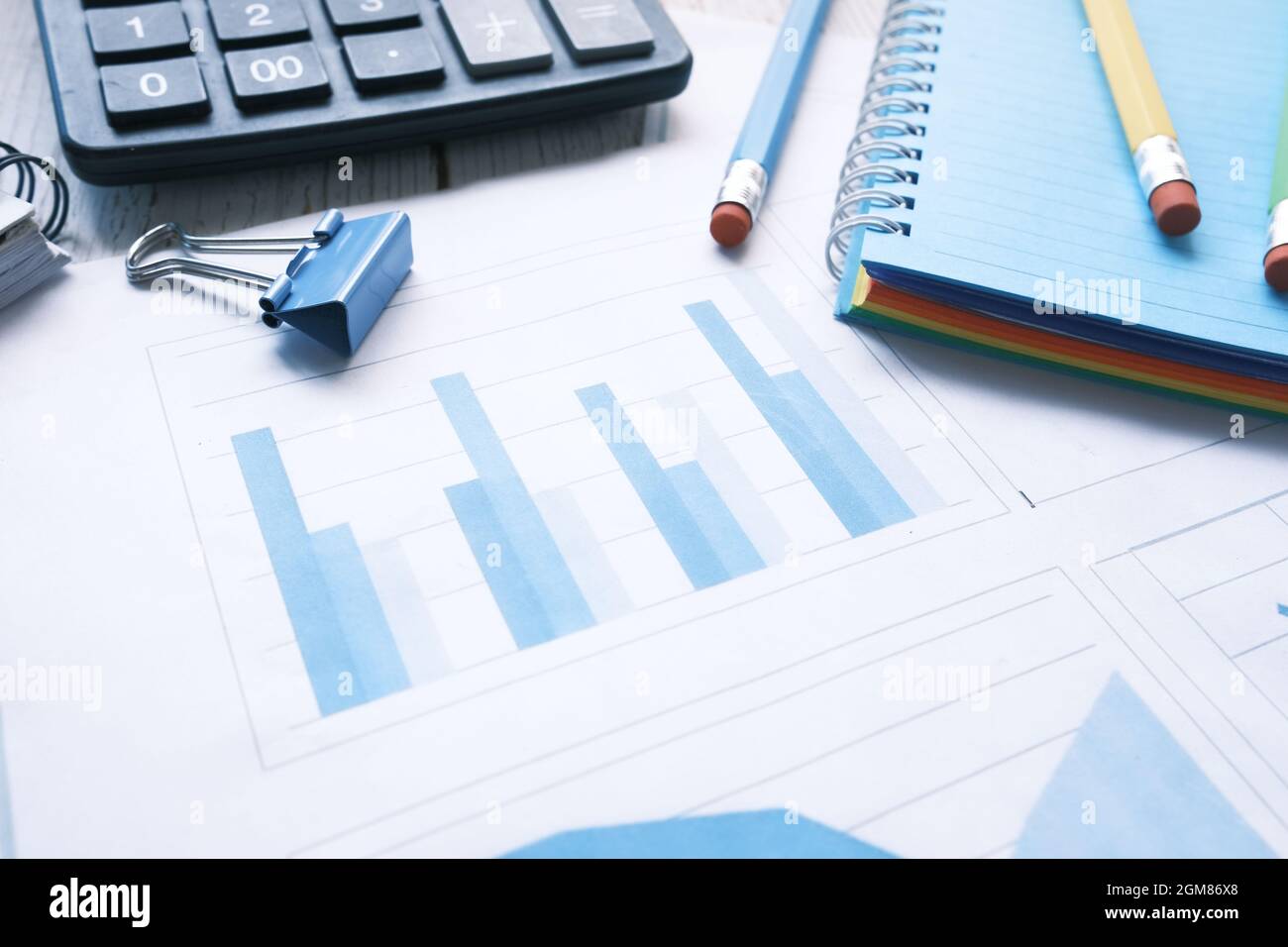 financial graph, calculator and notepad on table  Stock Photo