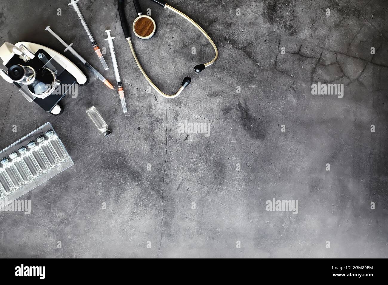 Vaccination. Disposable syringes and test tubes with medicinal vaccines ...