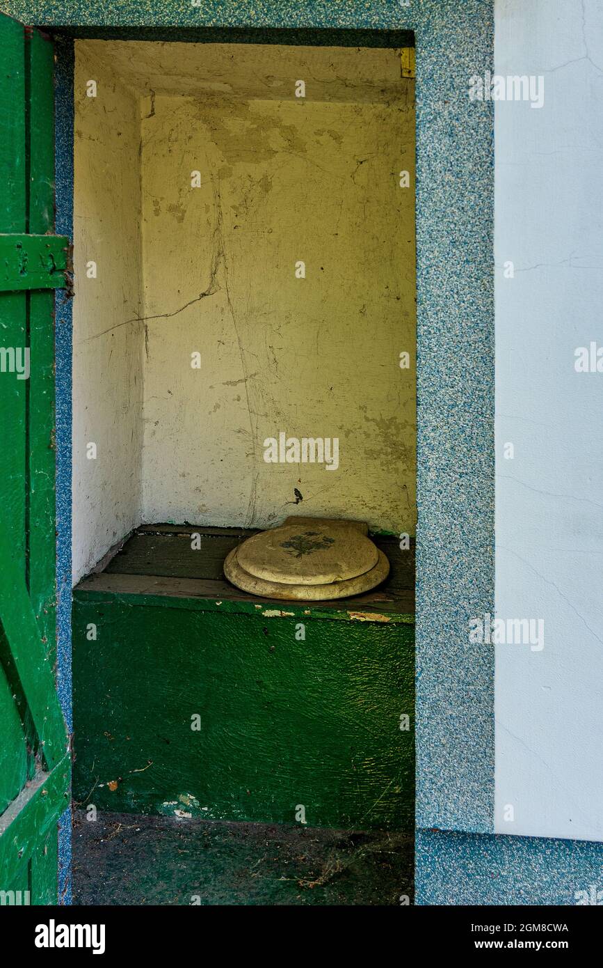 An old outhouse with a toilet seat Stock Photo Alamy