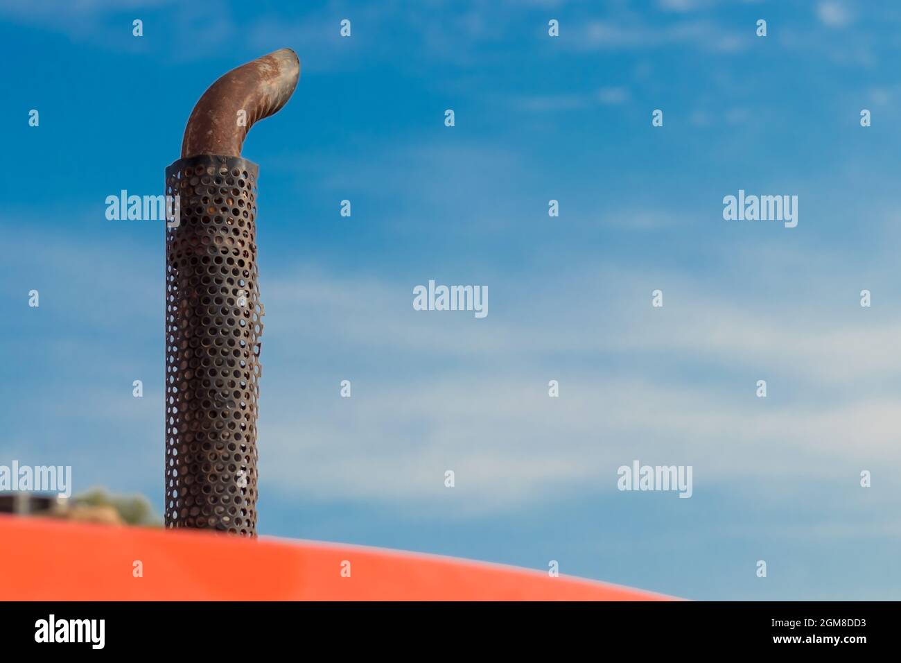 Exhausting pipe of a tractor with blue sky Stock Photo Alamy