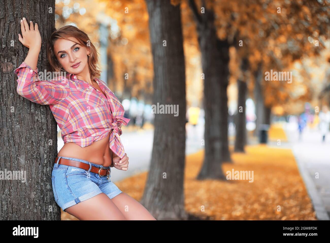 Beautiful girl in the park on a autumn sunny day walk Stock Photo - Alamy