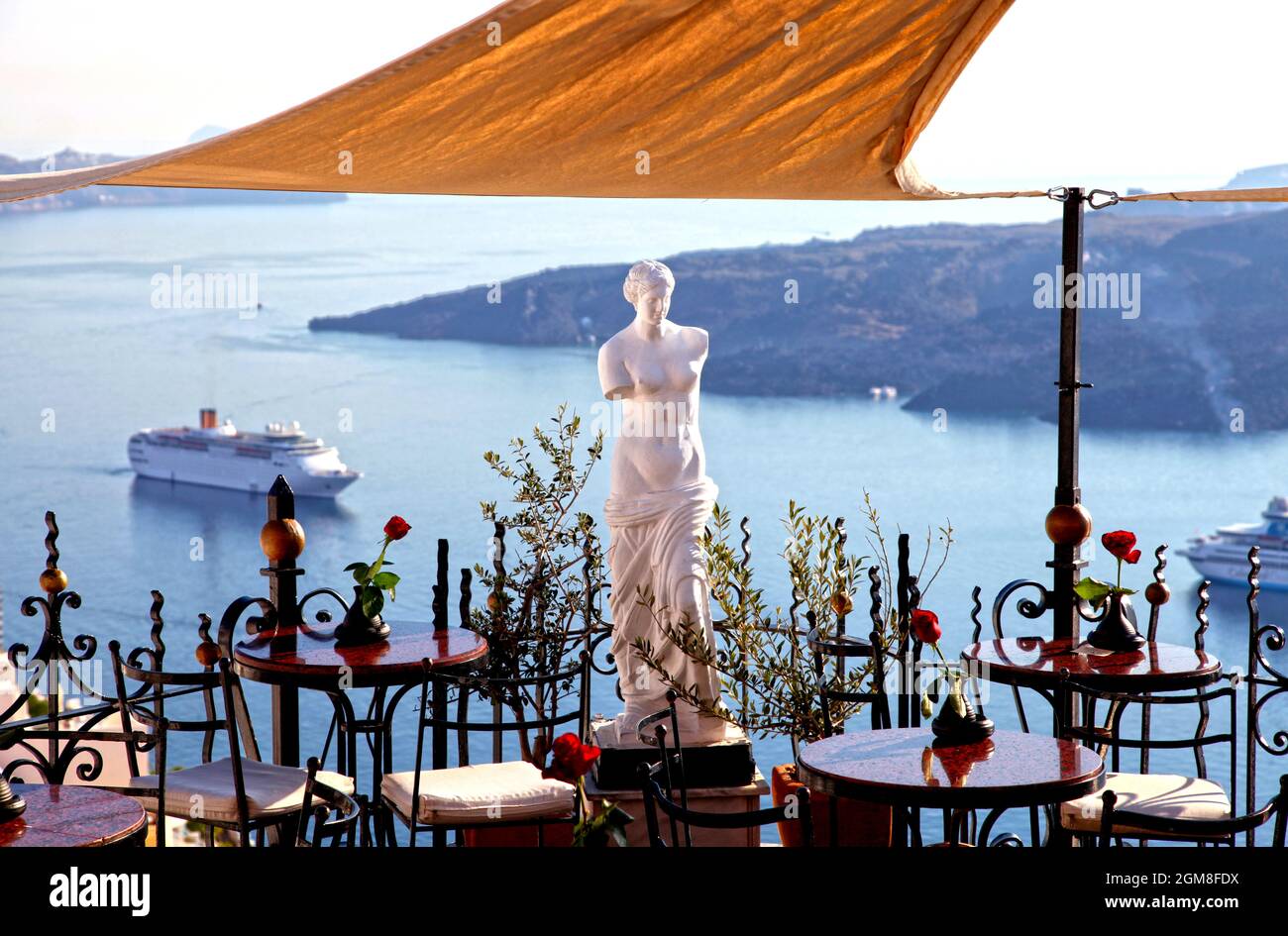 A view of the sea from PK Cocktail Bar with people in Fira, Santorini, Greek Islands, Greece
