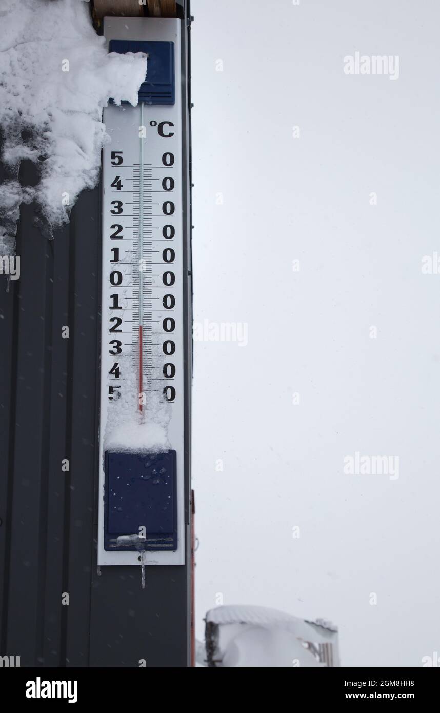 large outdoor thermometer. On a scale of minus 17 degrees Celsius. Cold seasonal weather. Snowy, wintery Stock Photo