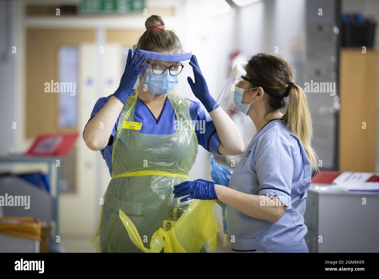 File photo dated 27/01/21 of nurses changing their PPE on Ward 5, a Covid Red Ward, at the Royal Alexandra Hospital in Paisley. Personal protective equipment (PPE) worth £2.8 billion is not fit for purpose and cannot be used by the NHS, a health minister has revealed. Issue date: Friday September 17, 2021. Stock Photo