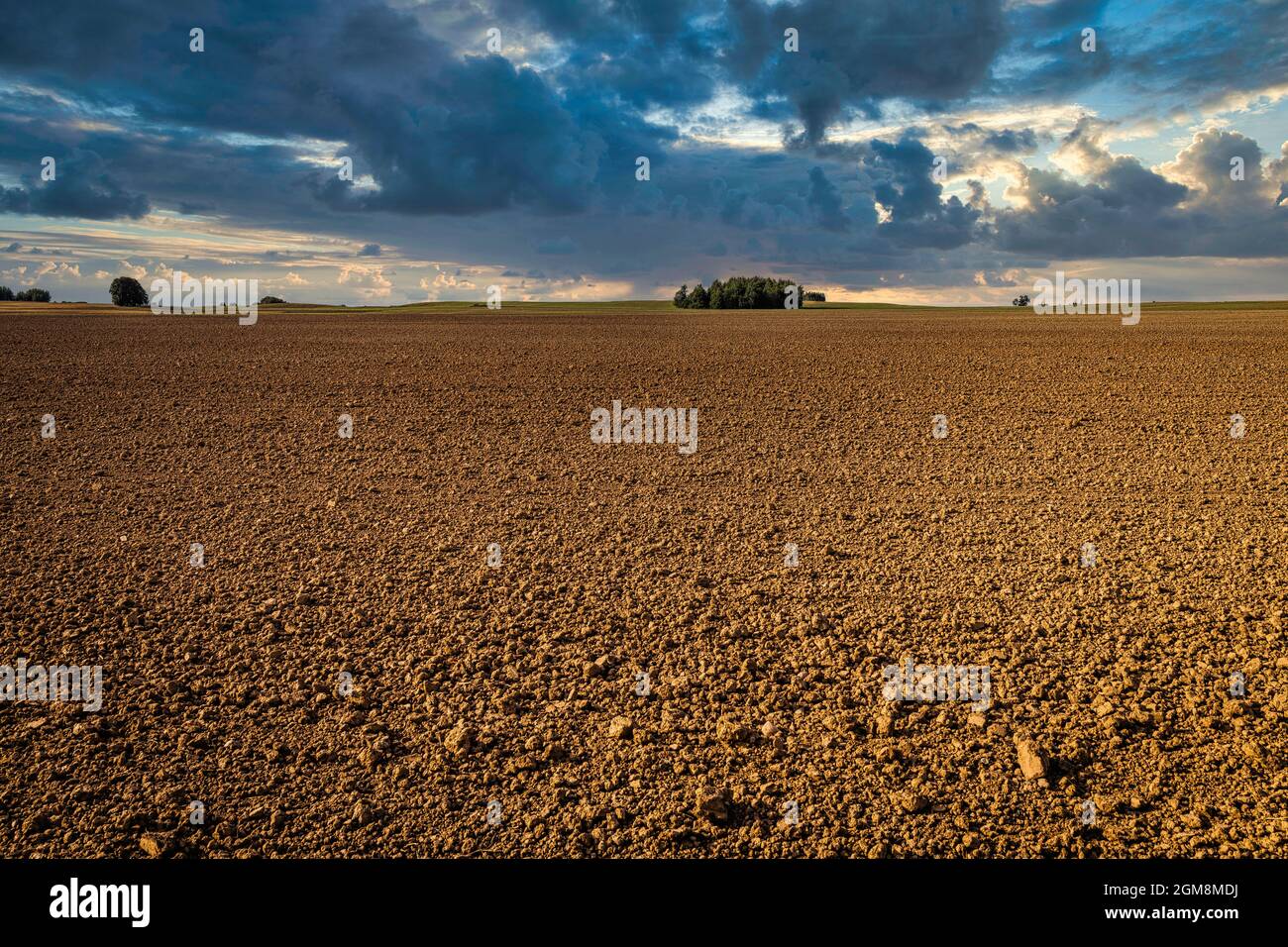 Ploughed Field with Dramatic Sky in the Background Stock Photo - Alamy