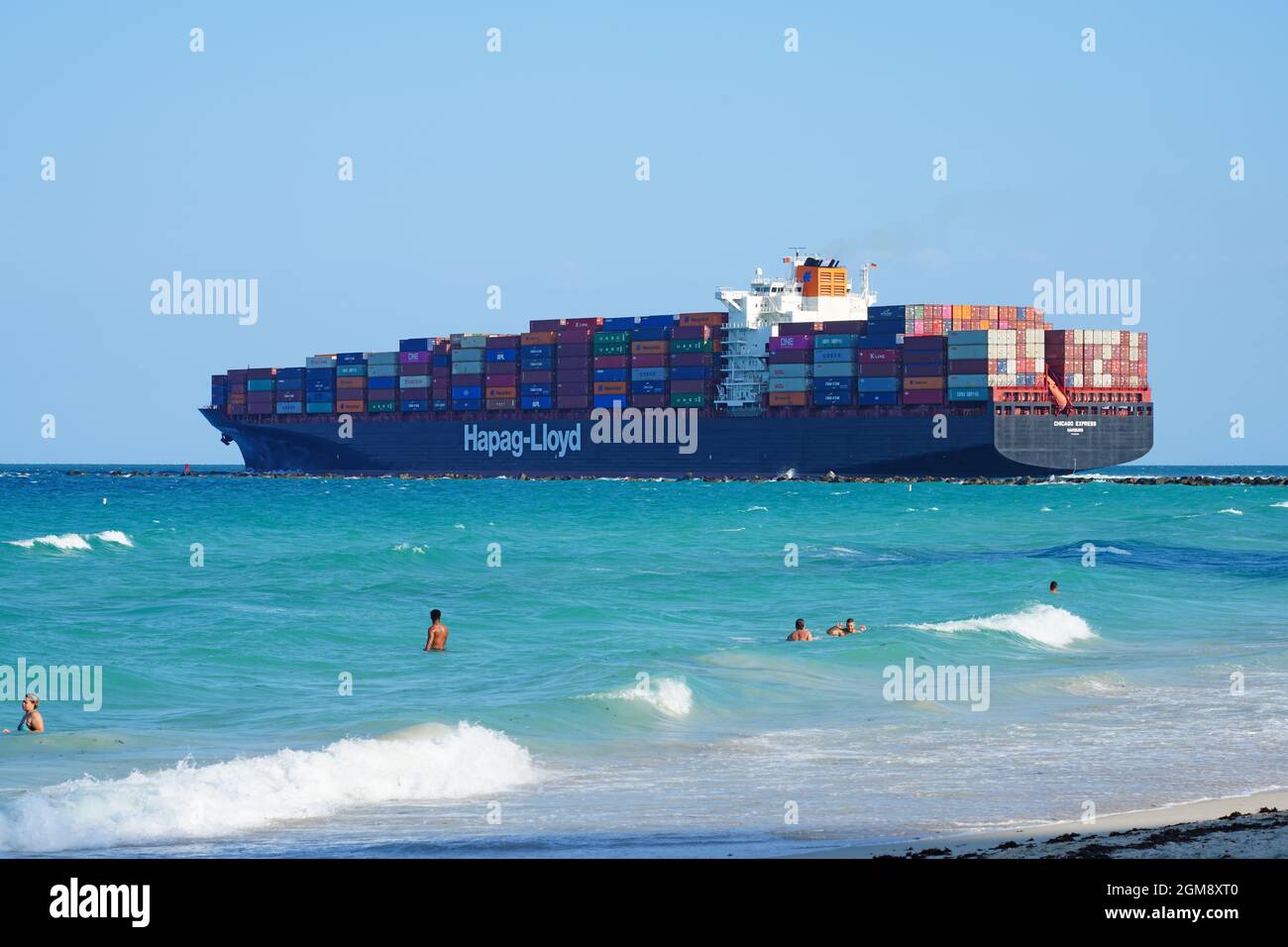 MIAMI BEACH, FL -23 APR 2021- View of a Hapag Lloyd freight cargo container ship from the beach in South Beach (SoBe) in Florida on the Atlantic Ocean Stock Photo