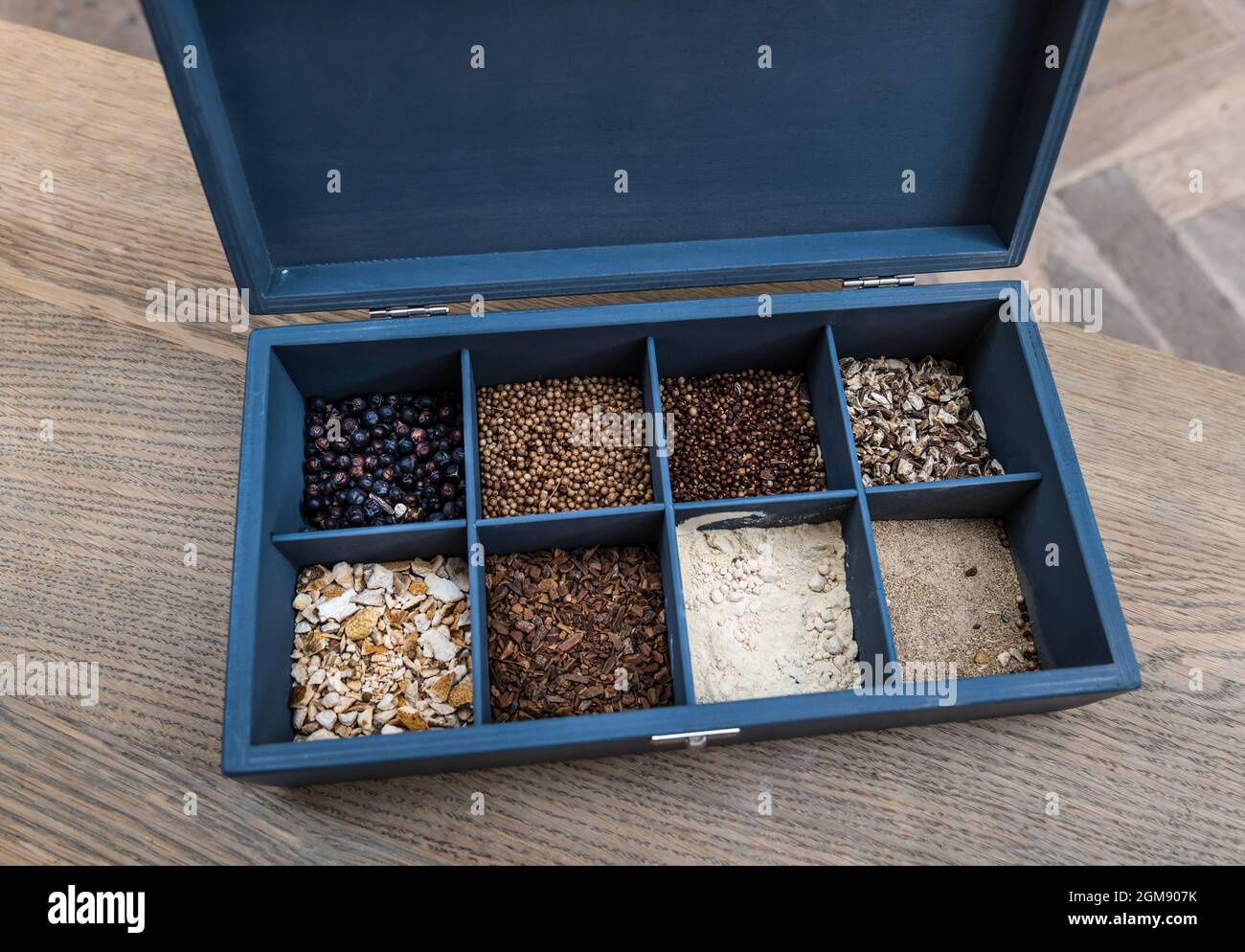 Gin botanicals and spices: juniper berries, coriander seeds, grains of paradise, angelica root, lemon peel, cassia bark, cardamom and orris root Stock Photo