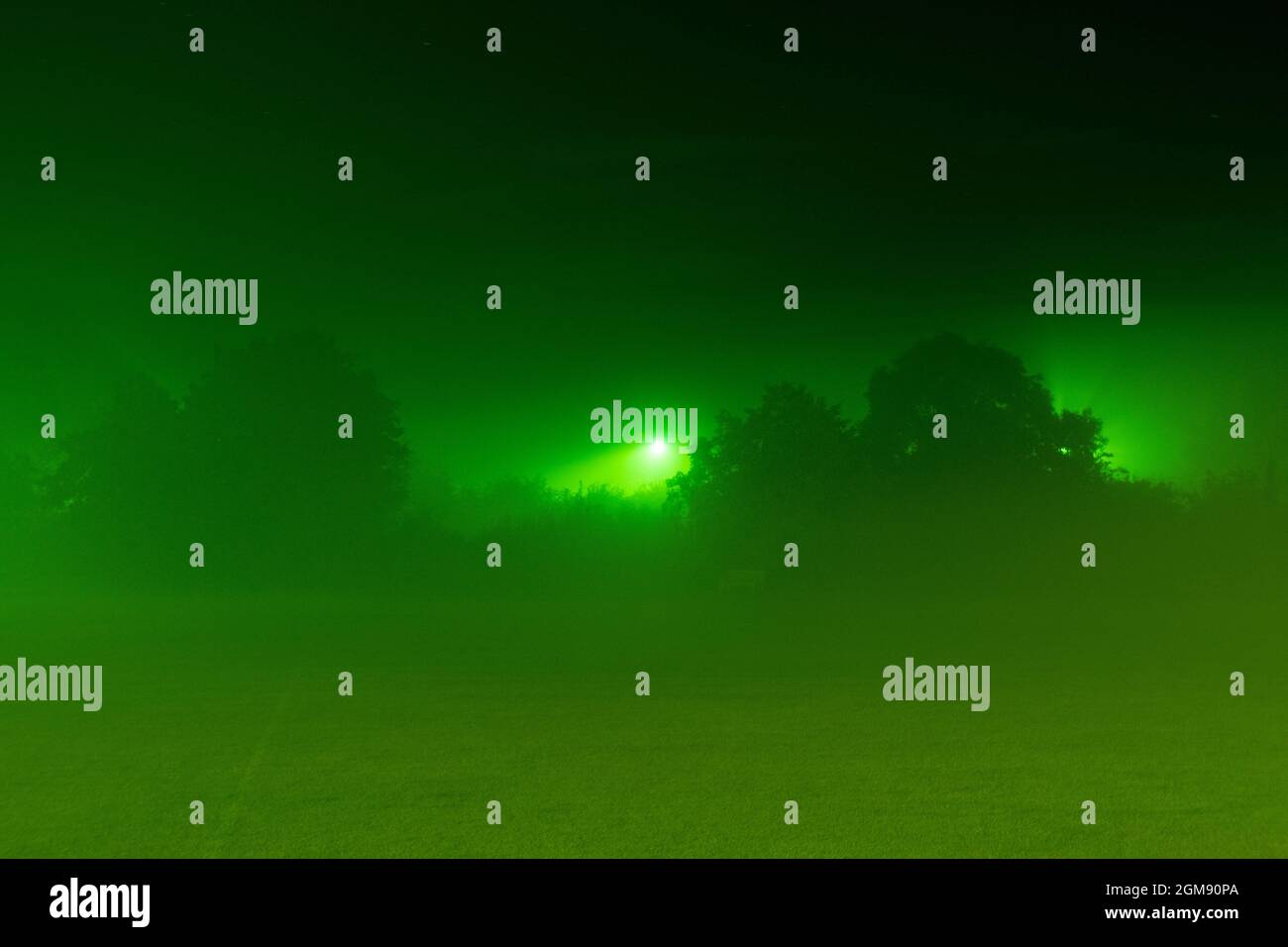 A green night vision concept of a spooky foggy night in the countryside Stock Photo