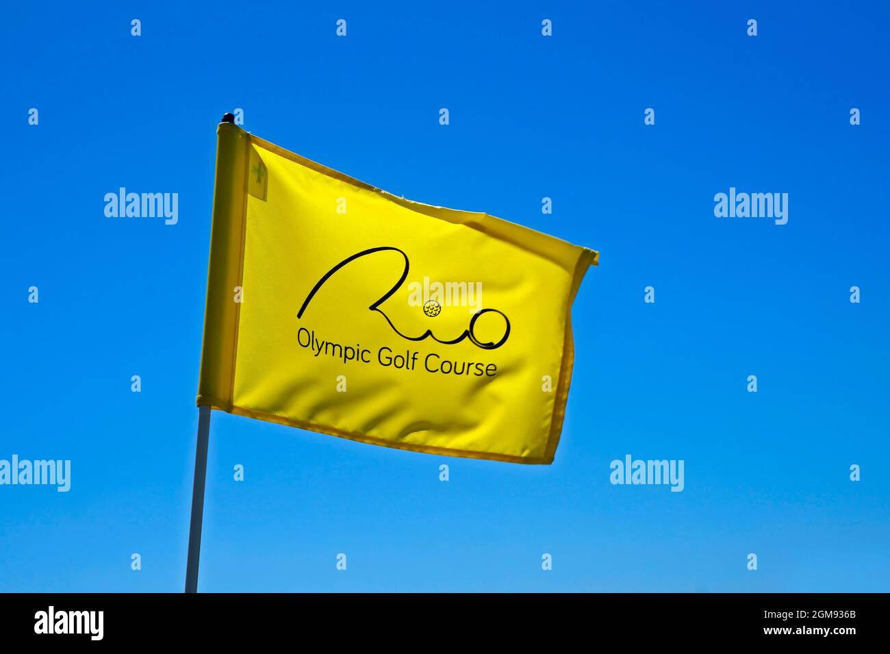 RIO DE JANEIRO, BRAZIL - DECEMBER 16, 2019: Yellow flag and blue sky at Rio Olympic Golf Course in Barra da Tijuca Stock Photo