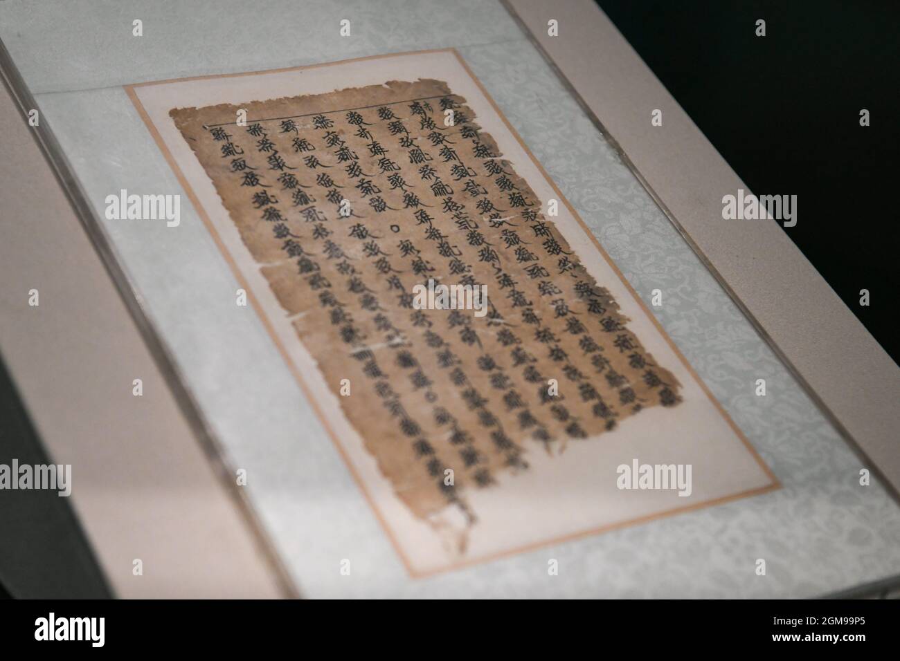 Chengdu. 17th Sep, 2021. Photo taken on Sept. 17, 2021 shows a herbal prescription written in language of Western Xia Dynasty (1038-1227) displayed during an exhibition featuring traditional Chinese medicine relics in Chengdu Museum in Chengdu, capital of southwest China's Sichuan Province. The exhibition, which kicked off here on Friday, showcases more than 300 traditional Chinese medicine-related relics. Credit: Xu Bingjie/Xinhua/Alamy Live News Stock Photo
