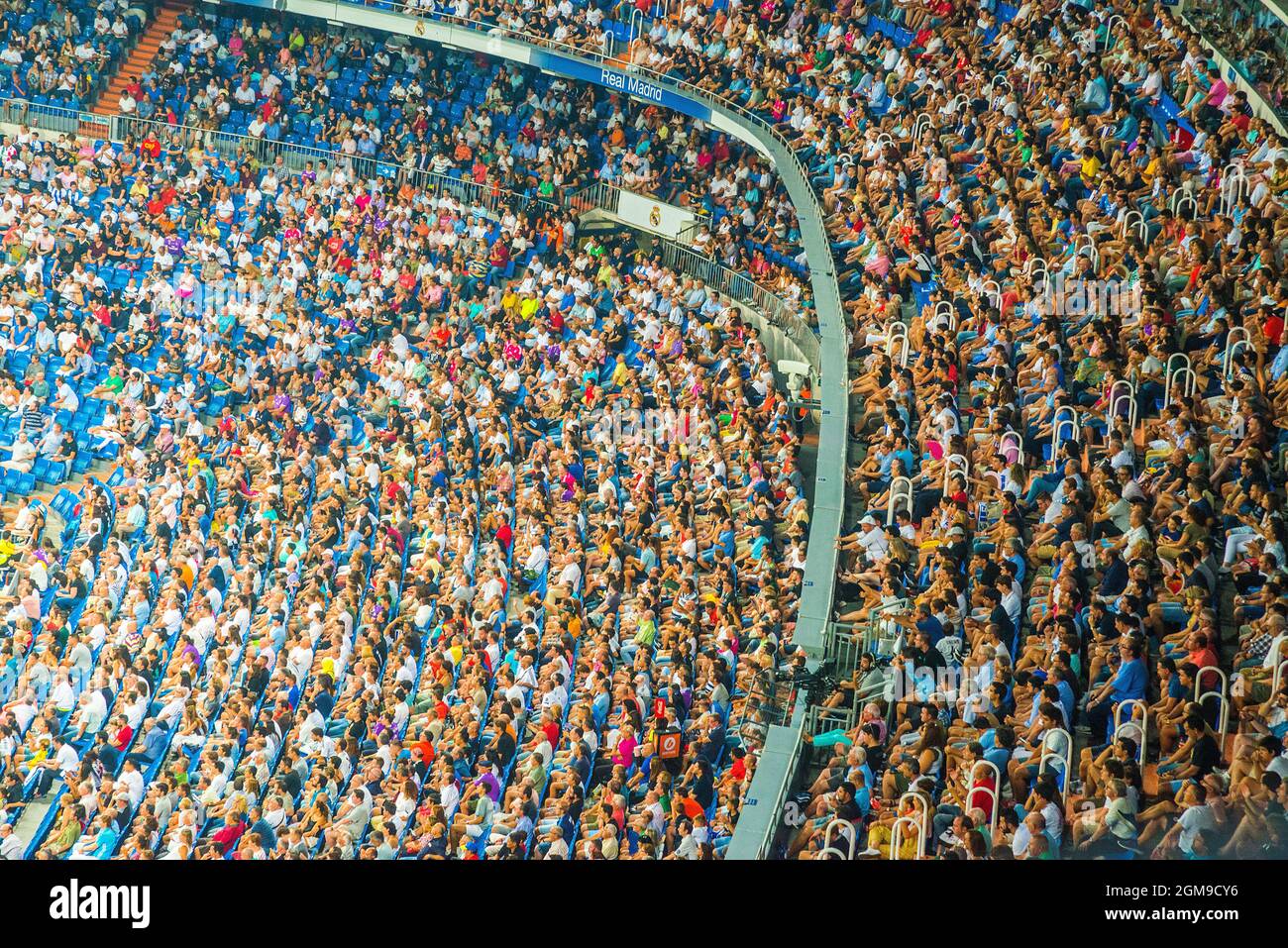 People during a football match.Santiago Bernabeu stadium, Madrid, Spain. Stock Photo