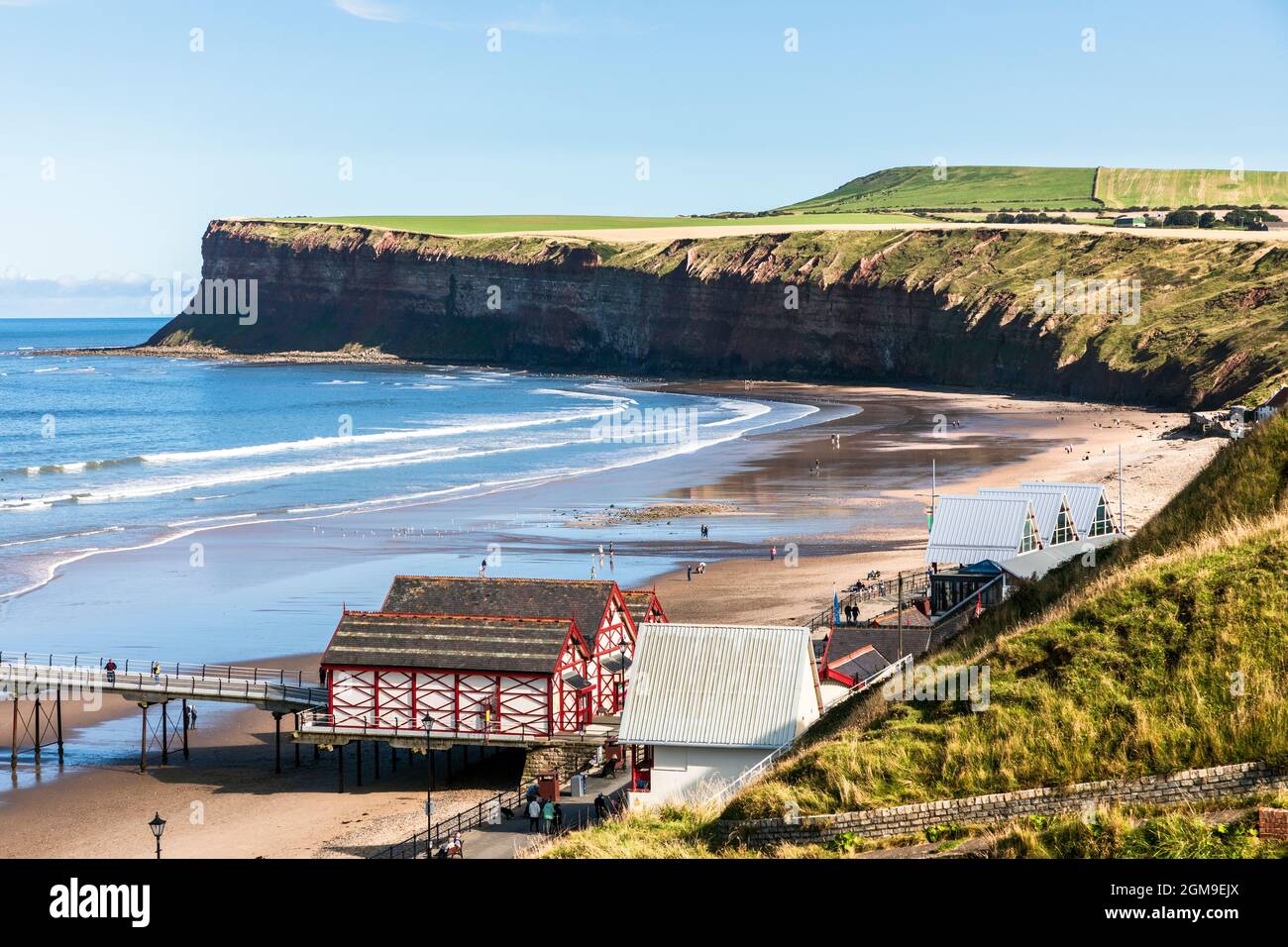 View towards Hunt Cliff Nature reserve, the highest cliffs on the north east coast of England and a famous seabird colony, over Saltburn beach Stock Photo