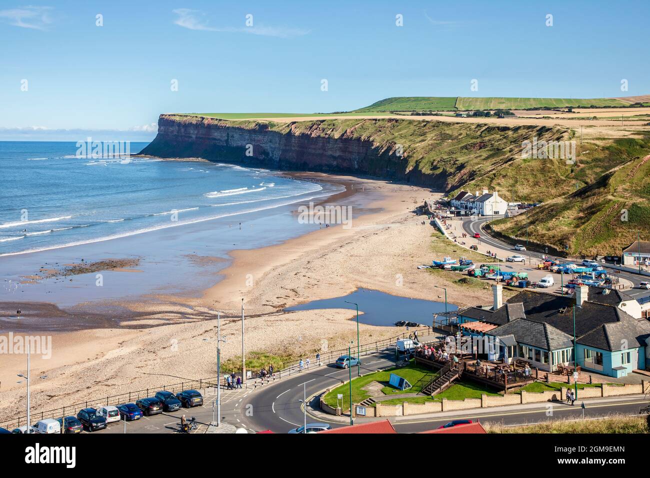 View towards Hunt Cliff Nature reserve, the highest cliffs on the north east coast of England and a famous seabird colony, over Saltburn beach Stock Photo